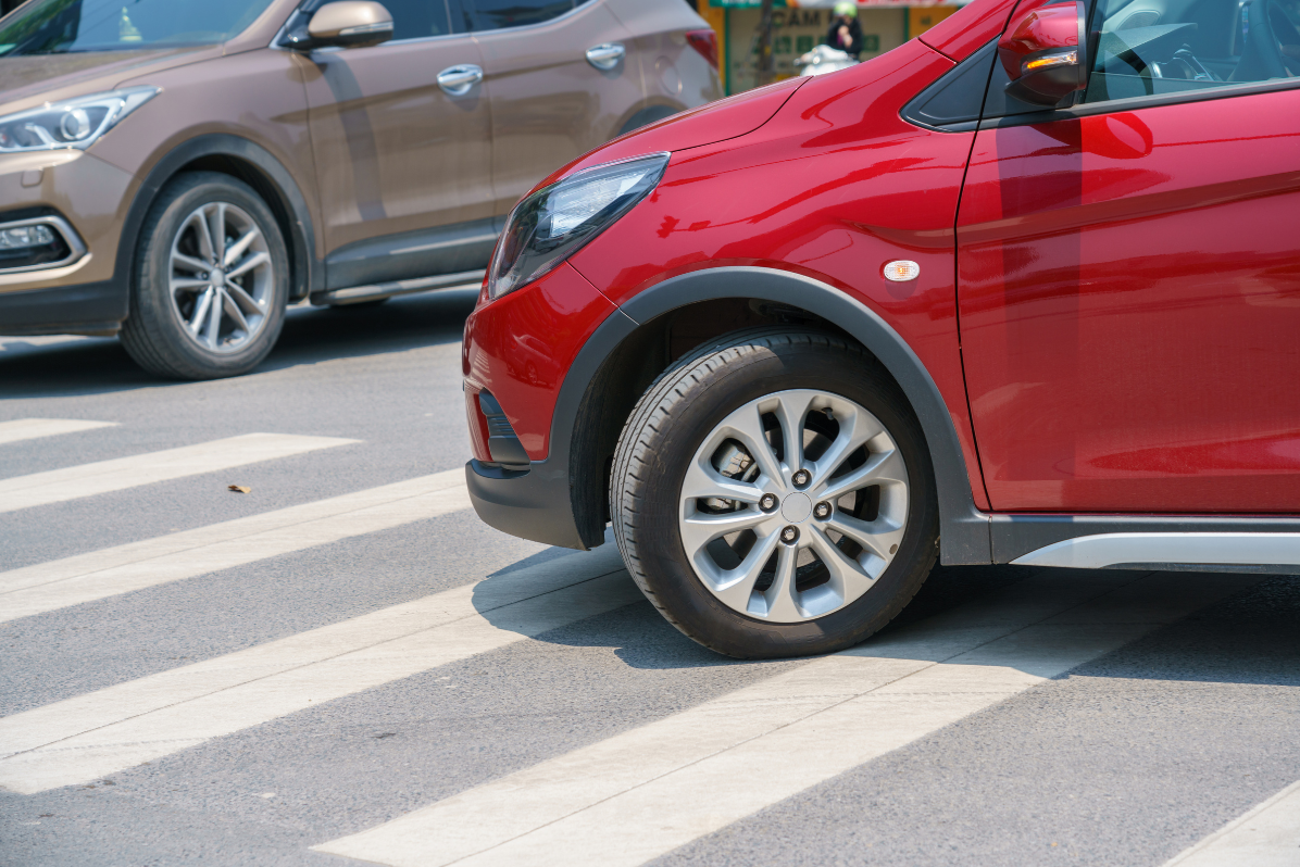 cars-crossing-crosswalk image