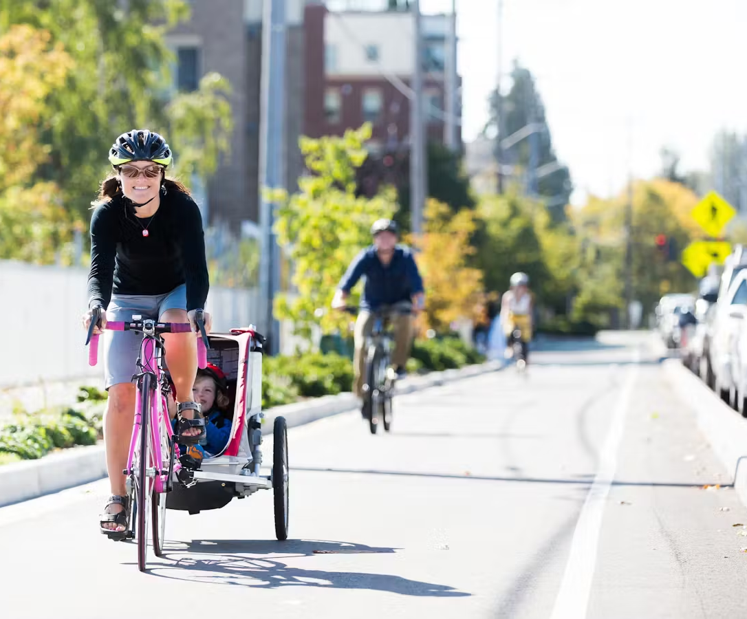 People for Bikes Class IV bike lane mom and kids riding